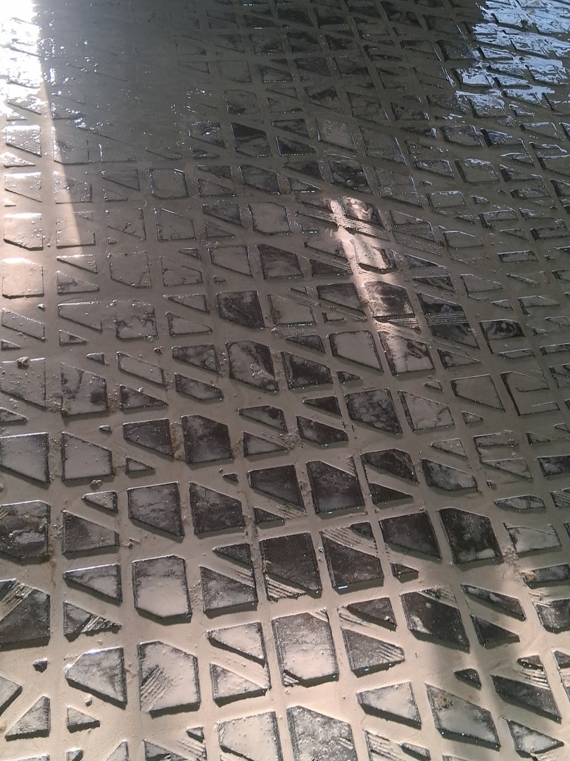Close-up of grooved concrete surface for cow traction